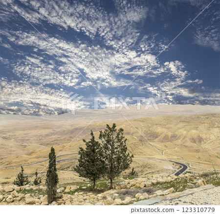 Typical mountain landscape, Jordan, Middle East (photography from a high point). Against the background of a beautiful sky with clouds Typical mountain landscape, Jordan, Middle East (photography from a high point). Against the background of a beautiful sky with clouds 123310779