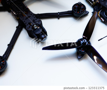 FPV drone in production on white background. 123311375