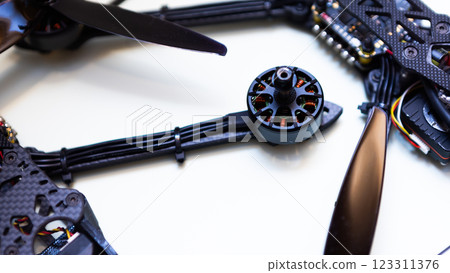 FPV drone in production on white background. 123311376