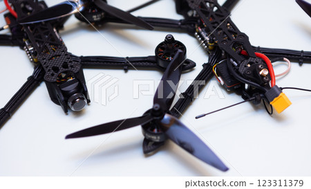 FPV drone in production on white background. 123311379