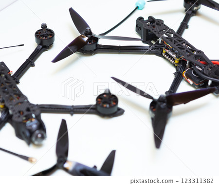 FPV drone in production on white background. 123311382