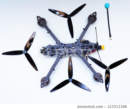 FPV drone in production on white background. 123311386