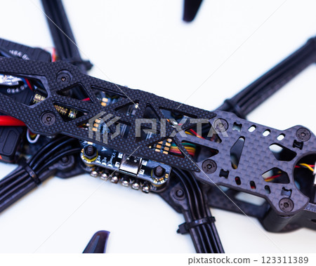 FPV drone in production on white background. 123311389