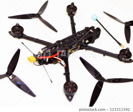 FPV drone in production on white background. 123311392