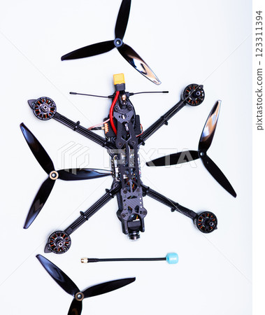 FPV drone in production on white background. 123311394