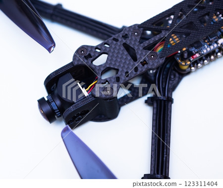 FPV drone in production on white background. 123311404
