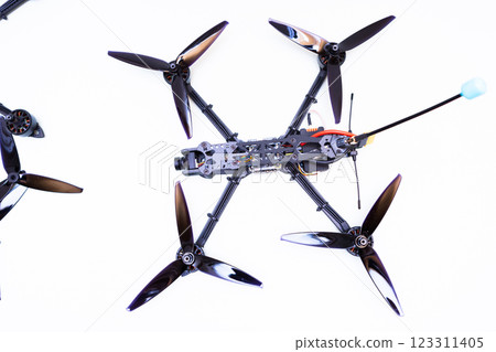 FPV drone in production on white background. 123311405