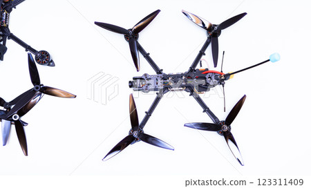FPV drone in production on white background. 123311409