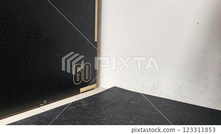 Set of fitness inventory on floor near brick wall. Space for text 123311853