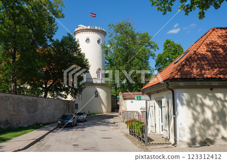 Latvian tourist landmark attraction - Tower of white castle. Part of old ancient Livonian castle ruins in old town of Cesis, Latvia. 123312412