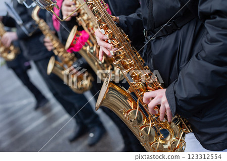 People playing saxophone in the street 123312554