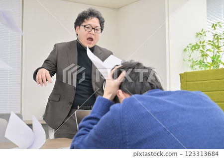 A man scolding his subordinate A man scolding his subordinate 123313684