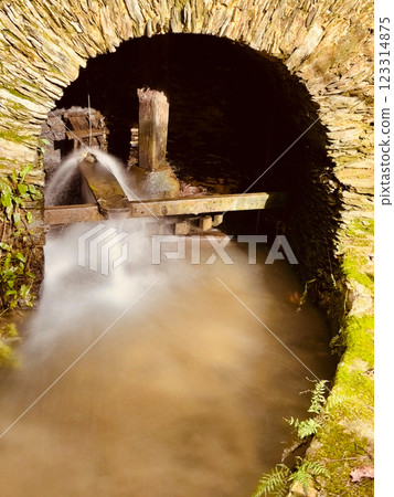 Old mill on the bank of the river Lourido in the park of the fountain of Stanislaus 123314875