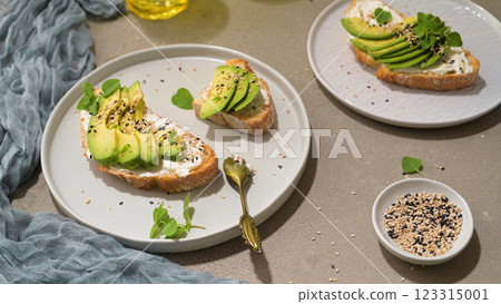Toast with avocado cream cheese and wheat bread Toast with avocado cream cheese and wheat bread 123315001