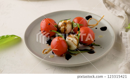 Caprese salad with tomato and mozzarella Caprese salad with tomato and mozzarella 123315421