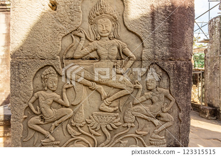 Ancient Bayon ruined temple walls decorated with dancing apsaras statues, Angkor Archaeological Park, Siem Reap, Cambodia Ancient Bayon ruined temple walls decorated with dancing apsaras statues, Angkor Archaeological Park, Siem Reap, Cambodia 123315515