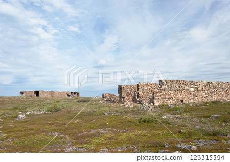 Abandoned ruined stone constructions in tundra 123315594