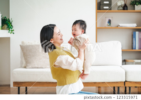 A mother holding a newborn baby 123315971