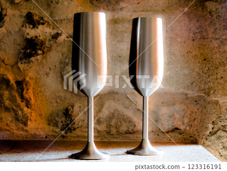 Two metal cups to toast with champagne in a romantic place Two metal cups to toast with champagne in a romantic place 123316191