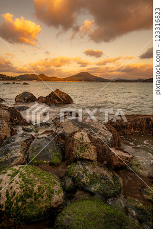 Sunset seen from the coastal rocks 123316823