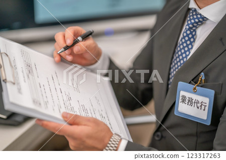 The agent staff writes the documents The agent staff writes the documents 123317263