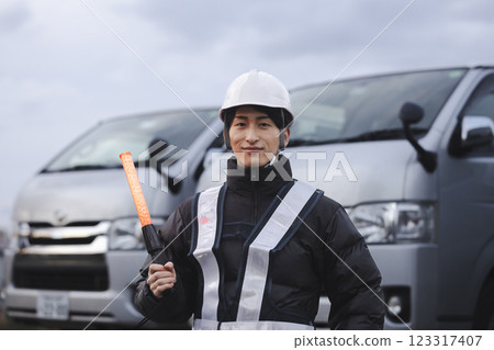 Worker standing in front of the truck Worker standing in front of the truck 123317407
