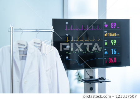 White coat and monitor displaying vital signs 123317507