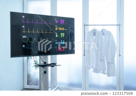White coat and monitor displaying vital signs 123317509