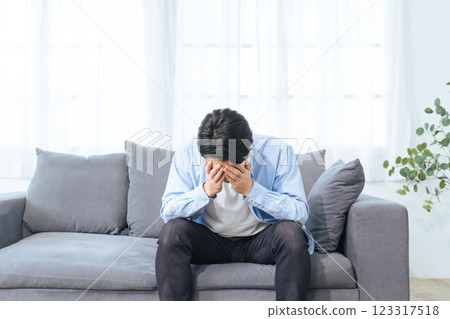 Depressed man in the room Depressed man in the room 123317518