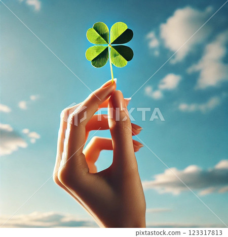 Hand with four leaf clover Hand with four leaf clover 123317813