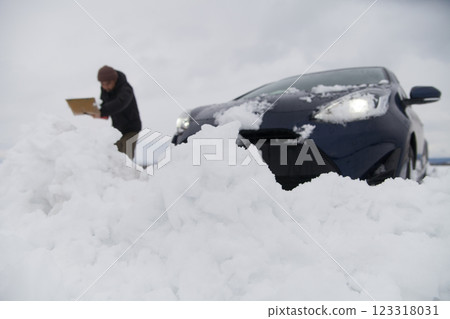 Car stuck on snowy road Car stuck on snowy road 123318031