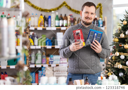 On New Year Eve, man choose and buy razor, shaver, 123318746