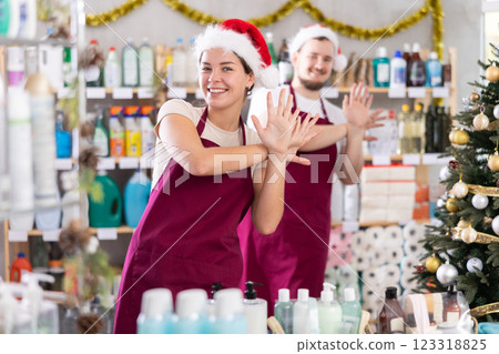 Woman and man sellers dance in household chemicals store Woman and man sellers dance in household chemicals store 123318825