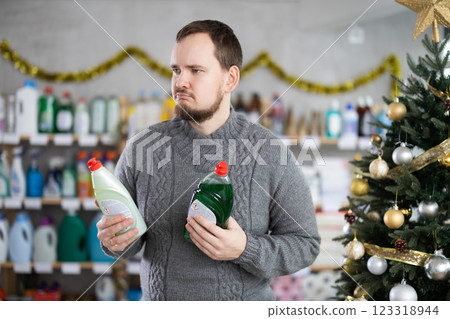 On New Year Eve, man choose and buy dishwashing soap On New Year Eve, man choose and buy dishwashing soap 123318944