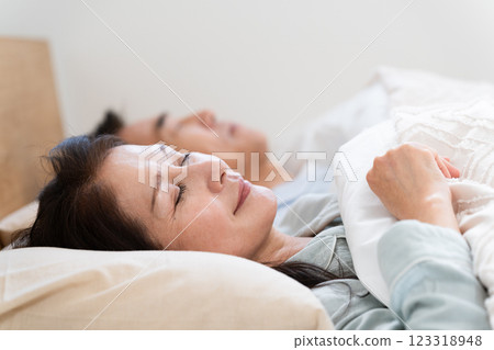 Couple sleeping on bed 123318948