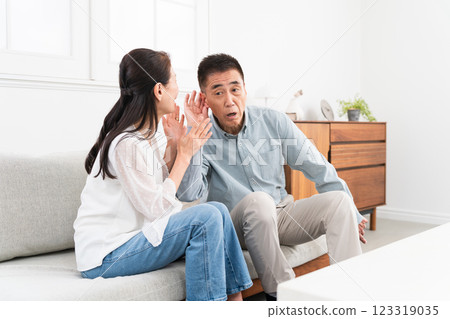 A wife who talks repeatedly to her deaf husband A wife who talks repeatedly to her deaf husband 123319035