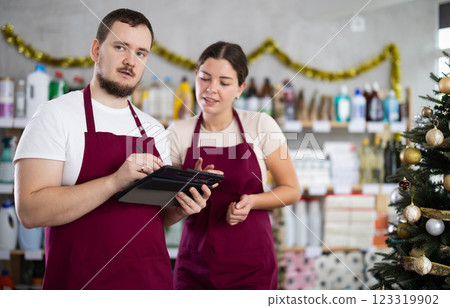 Store workers using tablet while discussing results of inventory Store workers using tablet while discussing results of inventory 123319902