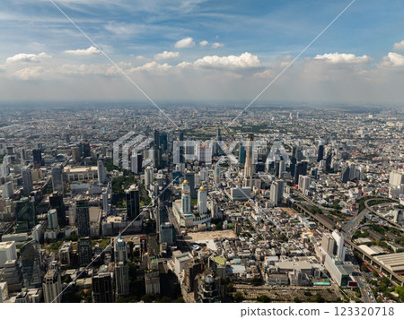 Prominent skyscrapers and urban sprawl make up the bustling Bangkok cityscape under clear skies. Bangkok, Thailand. Prominent skyscrapers and urban sprawl make up the bustling Bangkok cityscape under clear skies. Bangkok, Thailand. 123320718