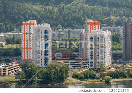 Multi storey building on the river bank. Residential areas. Multi storey building on the river bank. Residential areas. 123321253