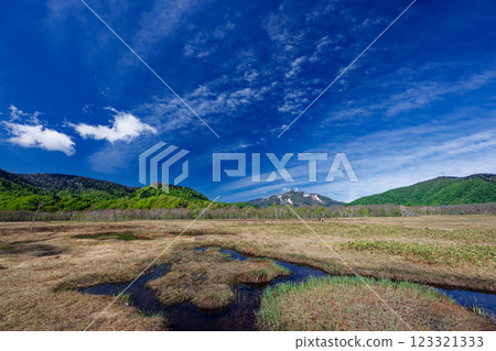 The ponds of Ozegahara in early summer and snow on Mt. Shibutsu 123321333