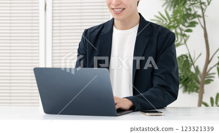Man using a computer Man using a computer 123321339