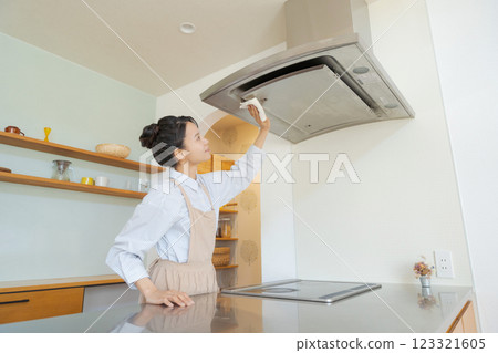 A woman cleaning a ventilator A woman cleaning a ventilator 123321605