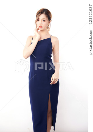 Beautiful face of young Asian woman in sexy dress Blue Perfect slim body on white background, plastic surgery and aesthetic cosmetology, Facial and skin care concept Beautiful face of young Asian woman in sexy dress Blue Perfect slim body on white background, plastic surgery and aesthetic cosmetology, Facial and skin care concept 123321627