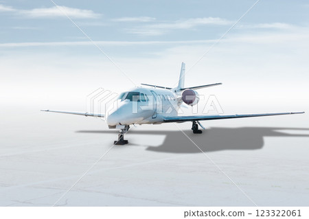 Modern white corporate business jet isolated on bright background with sky Modern white corporate business jet isolated on bright background with sky 123322061