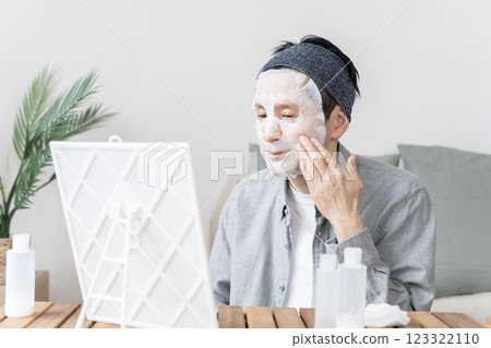 Middle-aged man using face mask, dry skin, moisturizing, face care 123322110