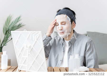 Middle-aged man using face mask, dry skin, moisturizing, face care 123322112