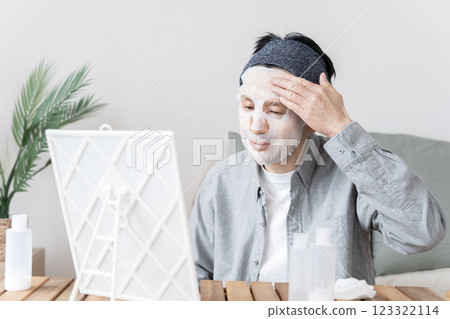 Middle-aged man using face mask, dry skin, moisturizing, face care 123322114