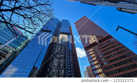 City skyline featuring modern and classic architecture, with prominent skyscrapers and urban buildings with colorful bright colors, capturing the essence of metropolitan life 123322171