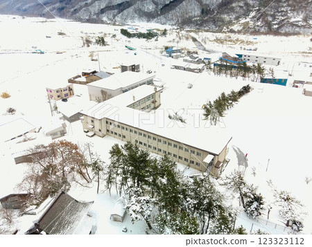 Aerial view of the abandoned Sakaehama Municipal Elementary School in Otobe, Hokkaido in winter Aerial view of the abandoned Sakaehama Municipal Elementary School in Otobe, Hokkaido in winter 123323112