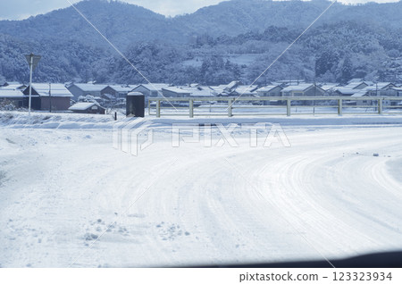 Snow-packed road in winter 123323934